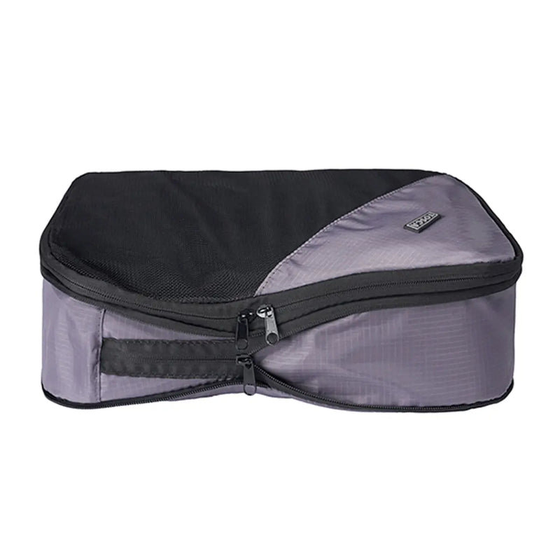 Second zipper compresses the contents of the cube