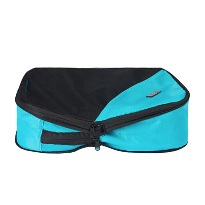 Second zipper compresses the contents of the cube