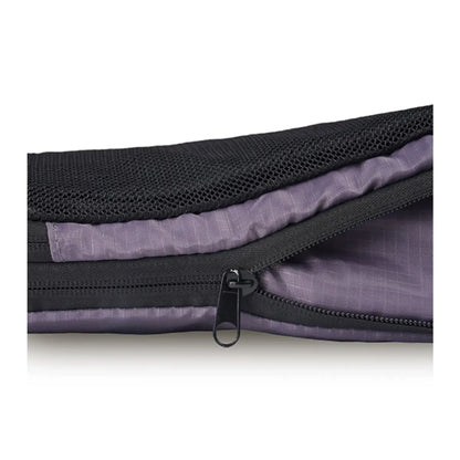 Second zipper compresses the contents of the cube