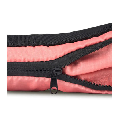 Second zipper compresses the contents of the cube