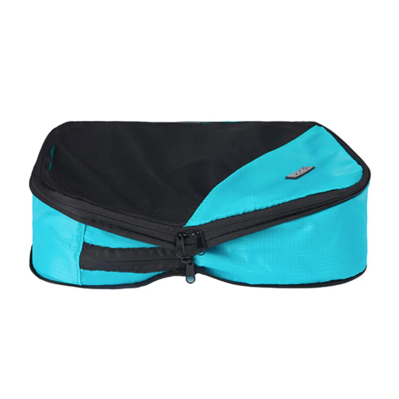 Second zipper compresses the contents of the cube