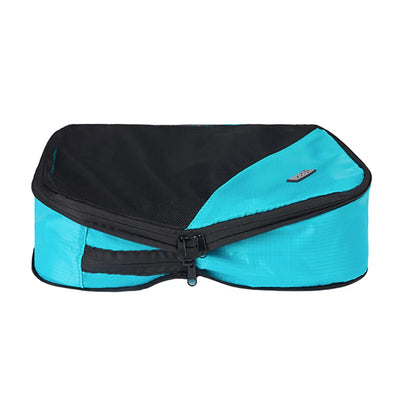 Second zipper compresses the contents of the cube