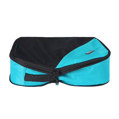 Second zipper compresses the contents of the cube