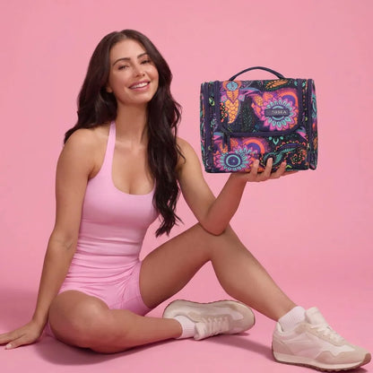 girl holding a Tosca So Lite Hanging Vanity Bag - Paisley