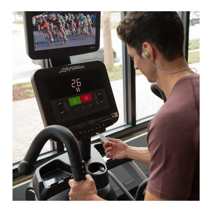 Plug this tiny transmitter into a headphone jack to listen to the TVs at the gym