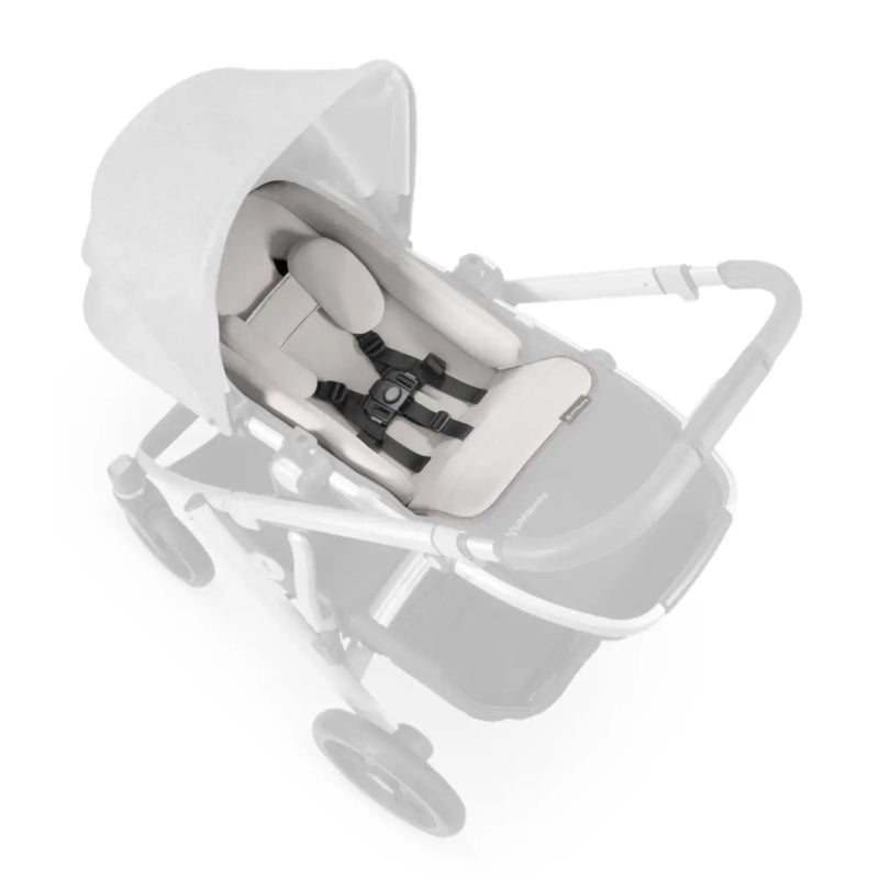 Softly cradles child while supporting their neck and back