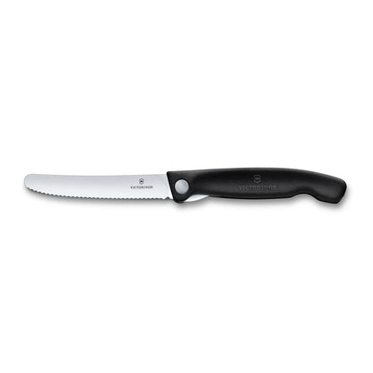 Victorinox Swiss Classic foldable paring knife in black, fully open side view showing the serrated wavy-edge blade and handle
