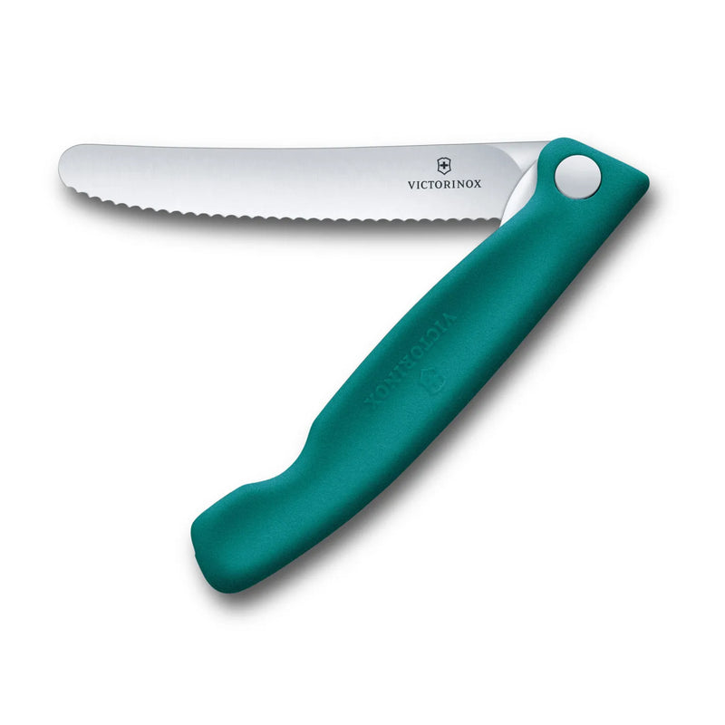 Victorinox Swiss Classic foldable paring knife in kale green, opened flat with the 11 cm serrated blade extended, seen from above
