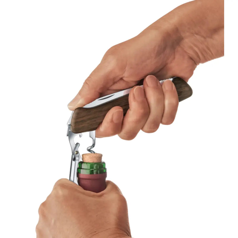 Unique combination tool houses a two-step lever for uncorking