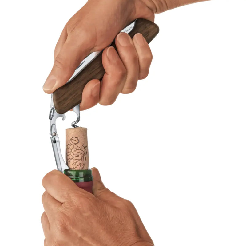 Unique combination tool houses a two-step lever for uncorking
